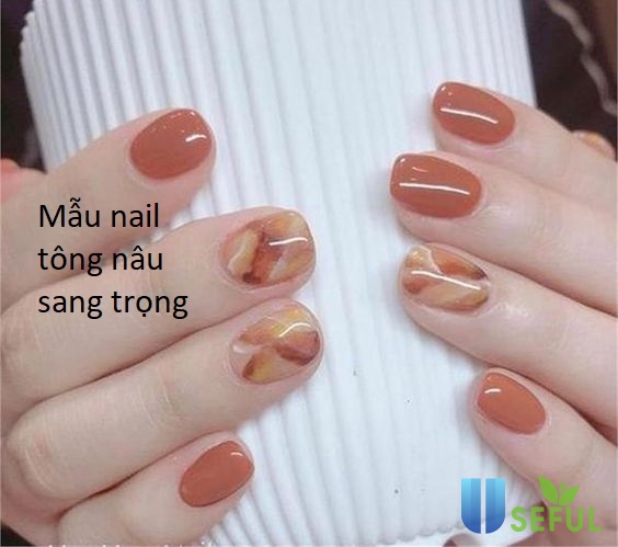 Bảng xếp hạng những mẫu nail màu nâu trầm sang trọng cho quý cô